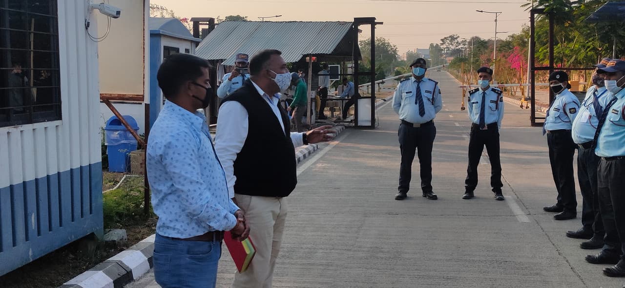 Security guards patrolling a modern facility.