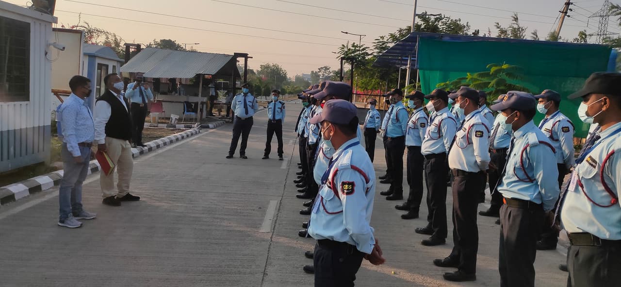 Security guards patrolling a modern facility.